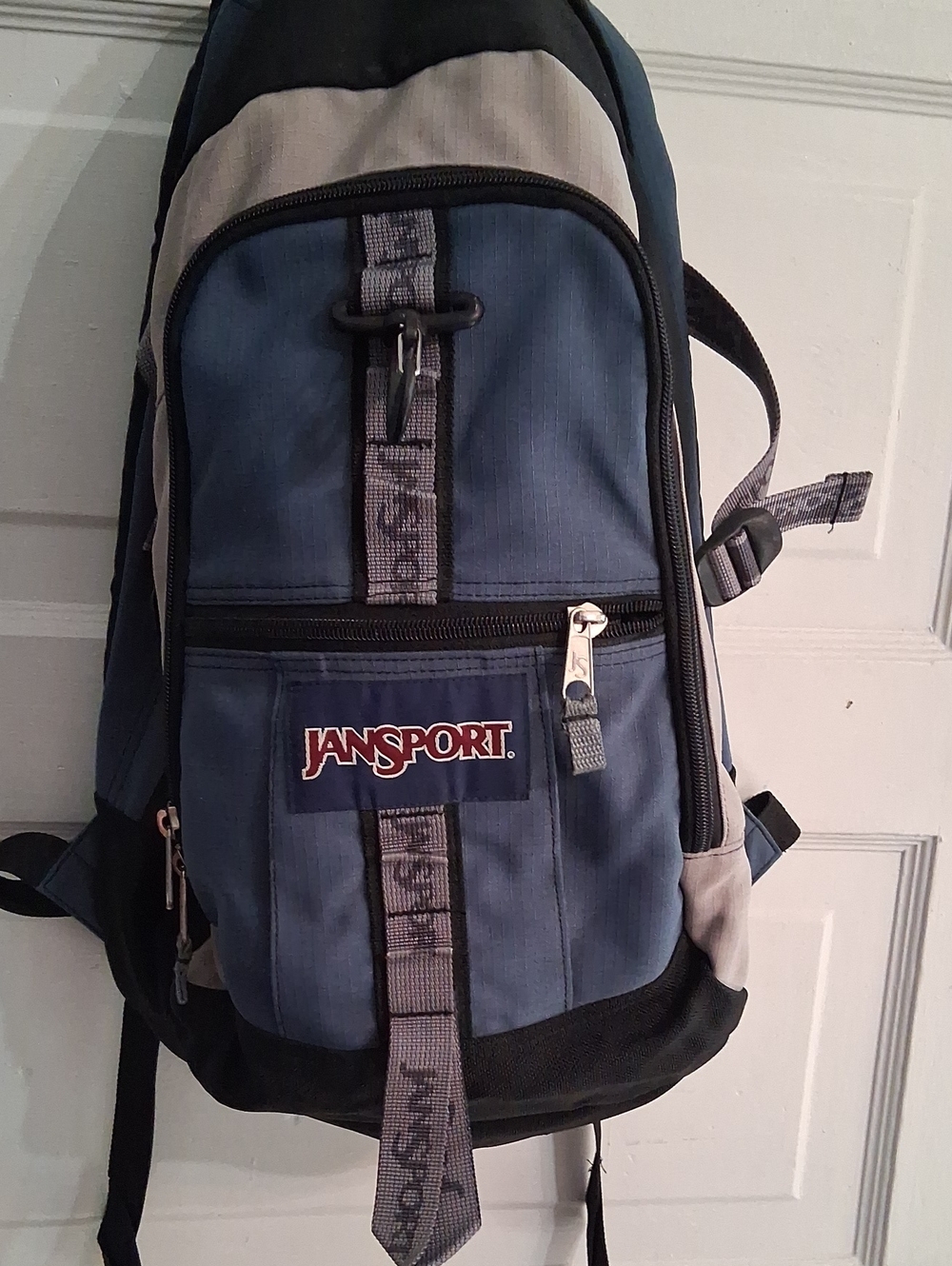 Long-Lasting Ergonomic Jansport Blue and Gray Sling Pack with Front Zip Pocket